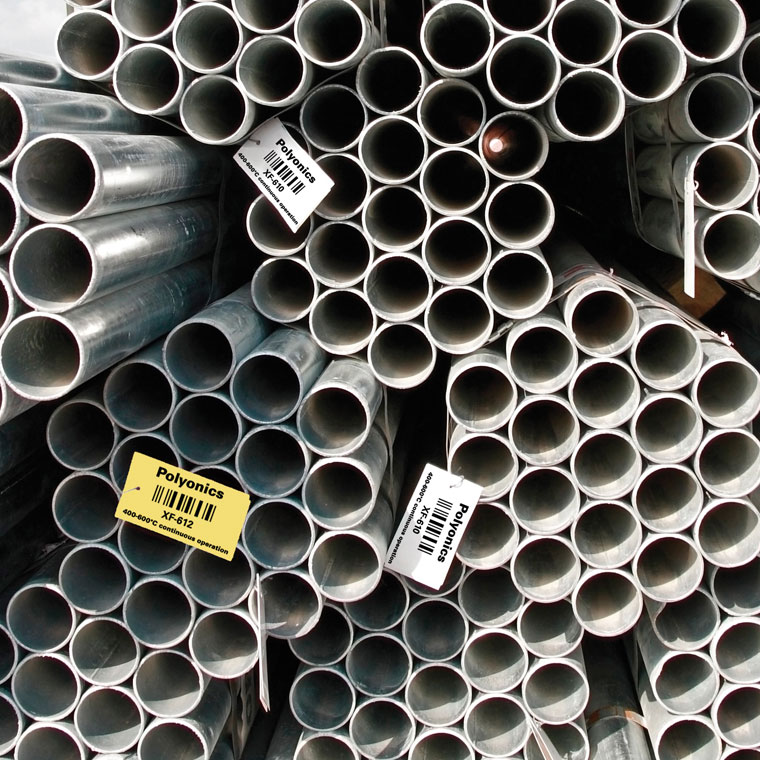 Heat resistant labels on metal pipes