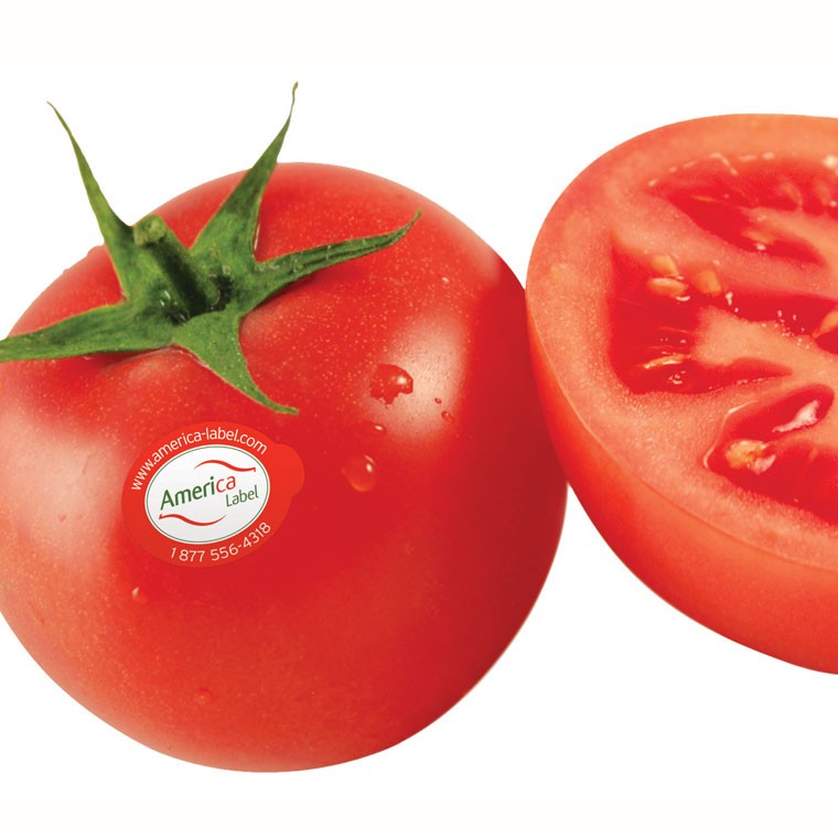 Tomate rouge avec étiquette contenant site internet et numéro de téléphone